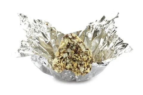 Chocolate truffle in candy wrapper Stock Photos