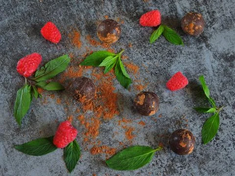 Chocolate truffle, raspberry and mint. Stock Photos