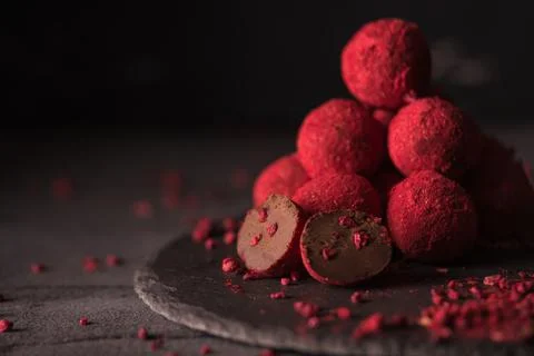 Chocolate truffle with raspberry powder Stock Photos