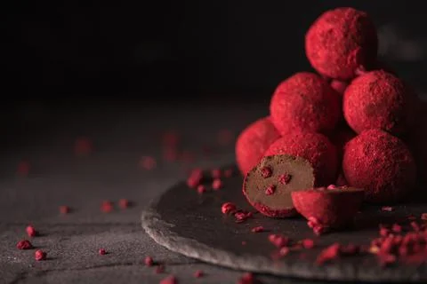 Chocolate truffle with raspberry powder Stock Photos