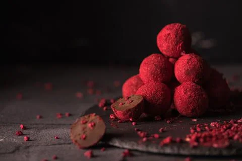 Chocolate truffle with raspberry powder Stock Photos