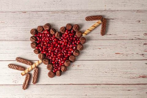 Chocolate truffles designed in heart shape and middle filled with pomegranate Stock Photos