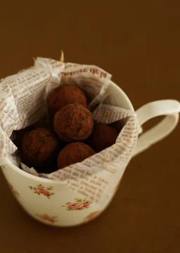 Chocolate truffles in a mug Stock Photos