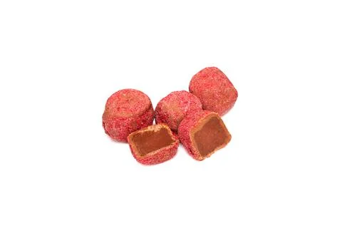Chocolate truffles with raspberry closeup isolated on white. Stock Photos
