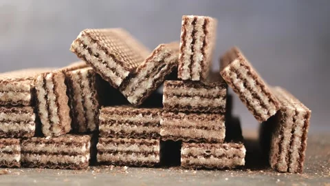 Chocolate wafer stacks on a table in bright light Stock Footage 333662714