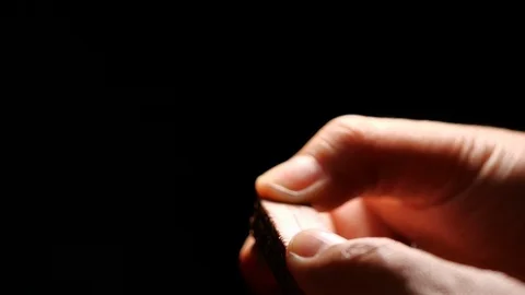 Chocolate waffle breaks down on black background in slow motion Stock Footage 125223584