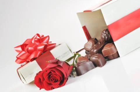 Chocolates and rose Stock Photos