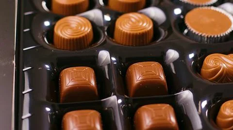 Chocolates in a box of several shapes Stock Photos