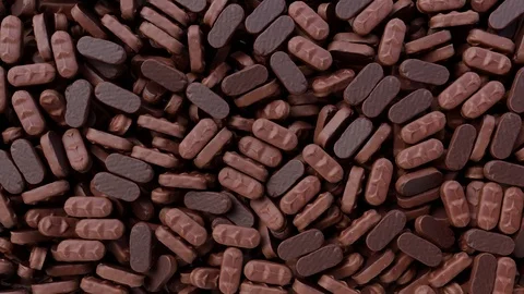 Chocolates falling down from above and filling the screen. 動画素材 98633868