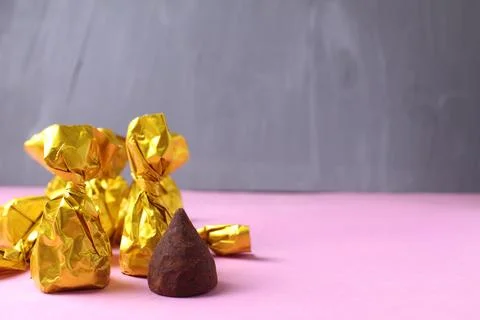 Chocolates on a gray background close-up with space for copyspace text. Pastr Stock Photos