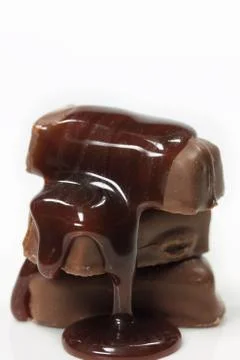 Chocolates isolated with syrup Stock Photos
