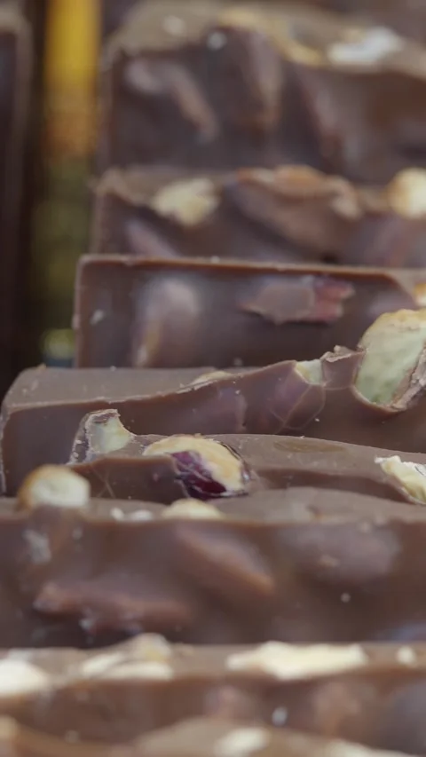 Chocolates with nuts on a table in closeup . Stock Footage 340597096