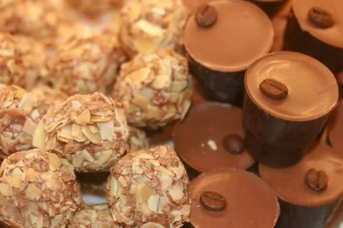 Chocolates with nuts. Texture of candy. Confectionery. Stock Photos