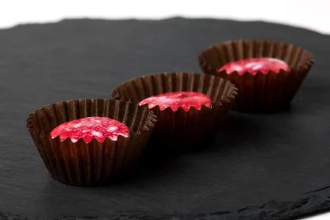 Chocolates in paper sockets Stock Photos