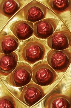 Chocolates in a red foil Foto stock