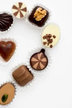 Chocolates in the shape of half heart Stock Photos