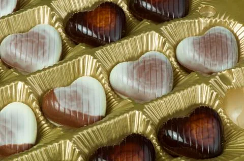 Chocolates in the shape of hearts Stock Photos