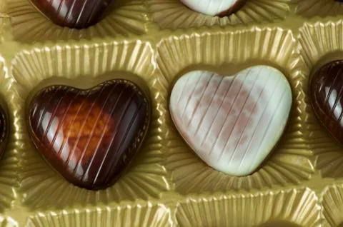 Chocolates in the shape of hearts Stock Photos