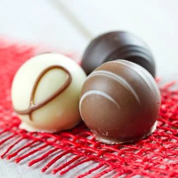 Chocolates on table Stock Photos