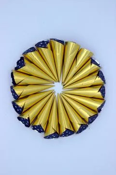 Chocolates wrapped in gold wrapper Stock Photos