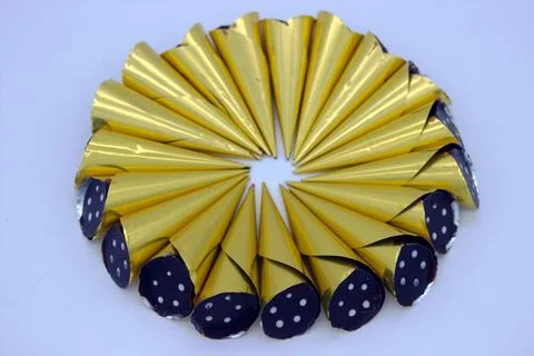 Chocolates wrapped in gold wrapper Stock Photos
