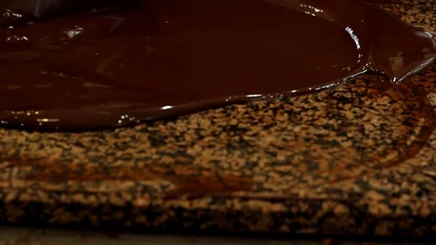 Chocolatier at work. Tempering chocolate. Tempering belgian chocolate. Stock Footage 117534020