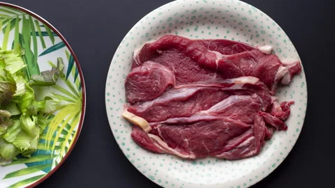 Choice between a meat dish and a salad dish. Zoom effect on the plates Stock Footage 150202227