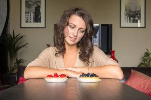 Choice between two cakes Stock Photos