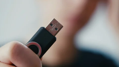 Choice of memory pendrive small disk held in hand, extreme close up shot Video stock 112345049