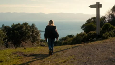 Choice Path, New Way. Hiker Woman Comes Down on the path, Direction Sign Stock Footage 246010910