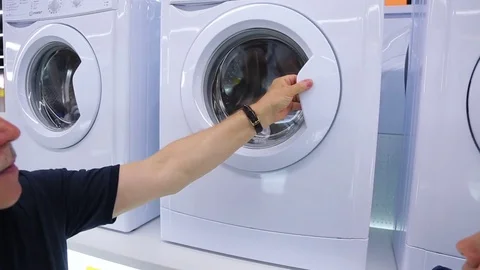 Choice of washing machine in shop, close-up Stock Footage