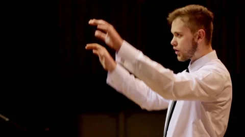 Choir conductor during performance Stock Footage 51678343