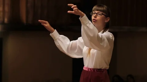 Choir conductor during performance Stock Footage 77728877
