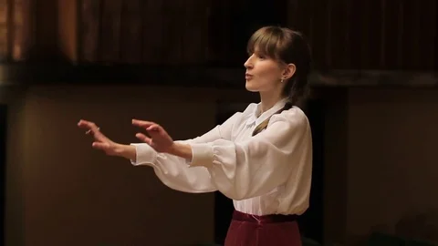 Choir conductor during performance Stock Footage 77728889