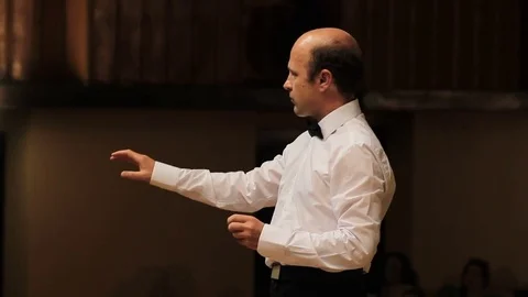 Choir conductor during performance Stock Footage 77729008