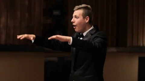 Choir conductor during performance Stock Footage 77729281