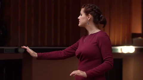 Choir conductor during performance Stock Footage 93516037