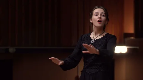 Choir conductor during performance Stock Footage 93516060