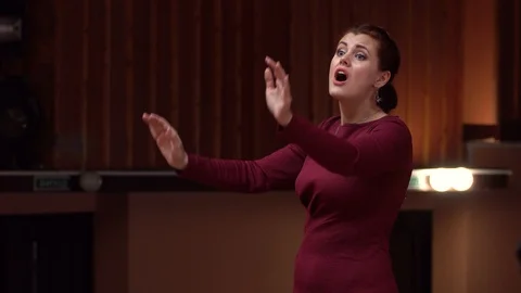 Choir conductor during performance Stock Footage 93516169