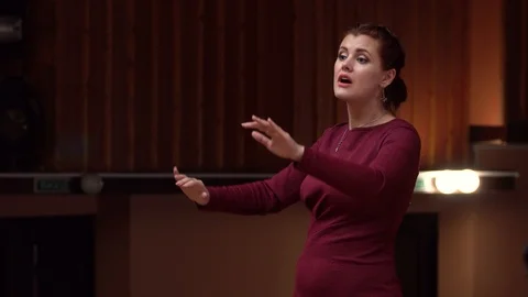 Choir conductor during performance Stock Footage 93517001