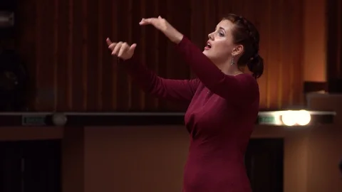 Choir conductor during performance Stock Footage 93517039