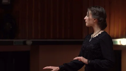 Choir conductor during performance Stock Footage 93520712