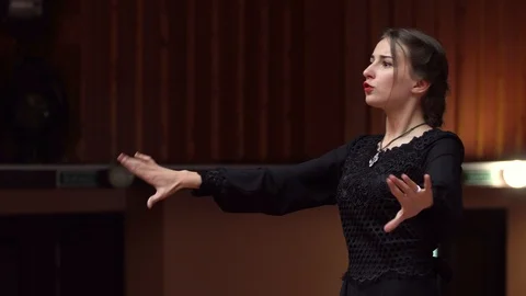 Choir conductor during performance Stock Footage 93523132