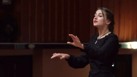 Choir conductor during performance Stock Footage 93523180