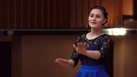 Choir conductor during performance Stock Footage 93523482