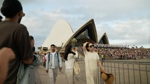 Choir on the steps of Sydney Opera House 6K Stock Footage 330381595