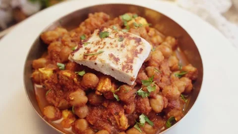 Chole masala vegetable or curry served in a bowl garnish with paneer cube. Stock Footage 282766768