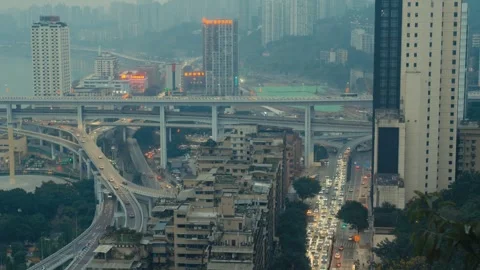 Chongqing Multi Level Highway Interchange with Metro Train and Dense City Stock Footage 334494268