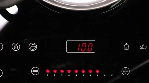 Choose function on Induction stove and set power of heating Stock Footage 155198752