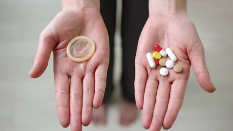 Choose Protection Method: Condom or Birth Control Pills Revealed. Stock Footage 258784027